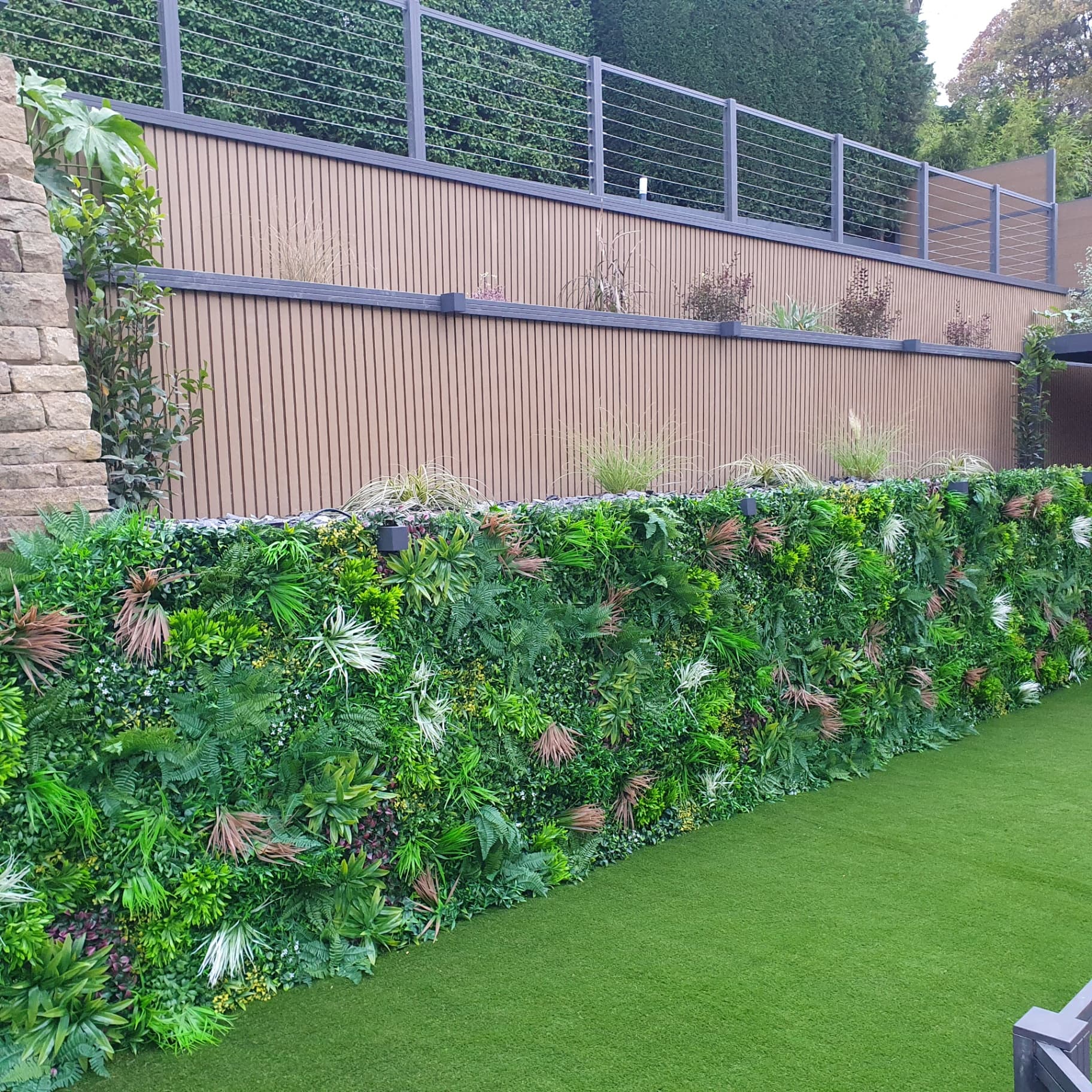 Artificial grass installation Sheffield with green wall